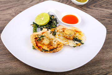Baked scallops with spinach