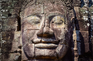 Detail of vintage stone face in the Bayan temple at Angkor Wat