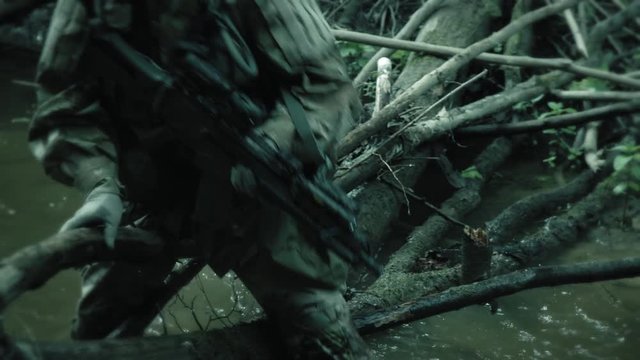 Soldiers crossing obstacles on the river
