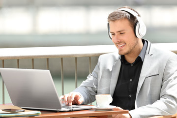 Executive working on line in a coffee shop