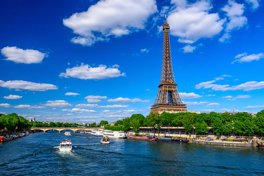 Paris Eiffel Tower and river Seine in Paris, France. Eiffel Tower is one of the most iconic landmarks of Paris.