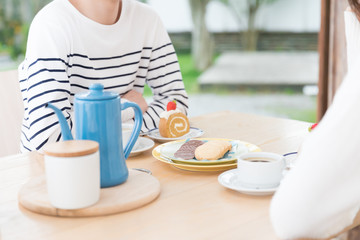 young asian couple relaxing in cafe