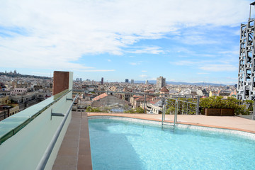 Fototapeta na wymiar Panoramic view of barcelona from a roof terrace with pool