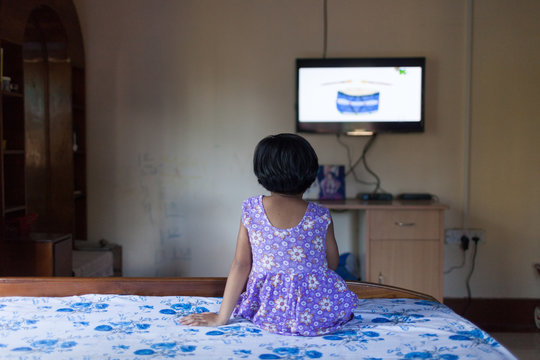 Little girl watching TV