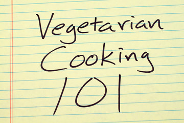 The words "Vegetarian Cooking 101" on a yellow legal pad