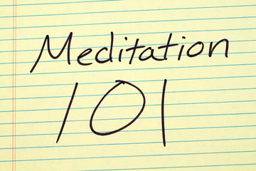 The words "Meditation 101" on a yellow legal pad