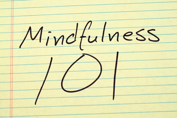 The words "Mindfulness 101" on a yellow legal pad
