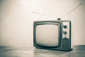 Retro obsolete TV from 70s. Vintage old style sepia photo