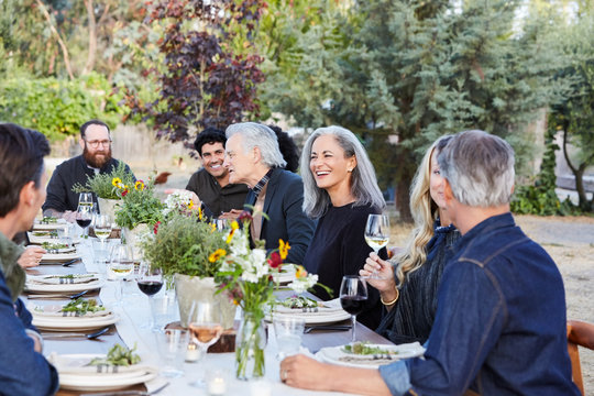 Group of friends enjoying a Farm To Table Dinner Party