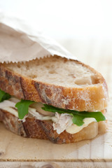 Chicken sandwich on wooden table