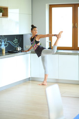 Fitness girl cooking healthy food in the kitchen. Woman. Kitchen. Cooking