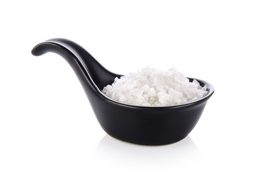 salt in spoon on white background