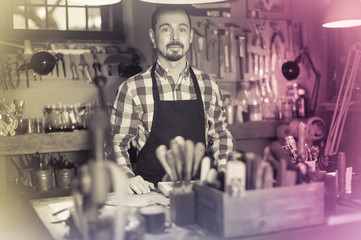 Professional man worker displaying his workplace