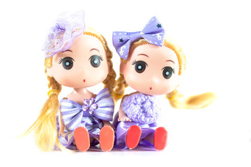 Dolls with Wearing a purple dress Blond hair on white background.