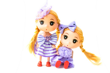 Dolls with Wearing a purple dress Blond hair on white background.