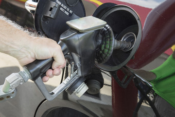 Man pumping gas into car