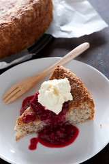 fresh baked cake with raspberries and cream