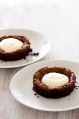 fresh baked choc cakes on wooden table