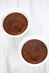 fresh baked choc cakes on wooden table
