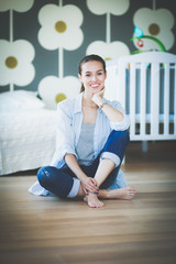 Young woman doing yoga at home in the lotus position. Young woman doing yoga.