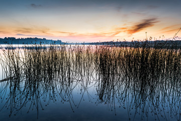 The sky and the lake in the twilight after sunset.