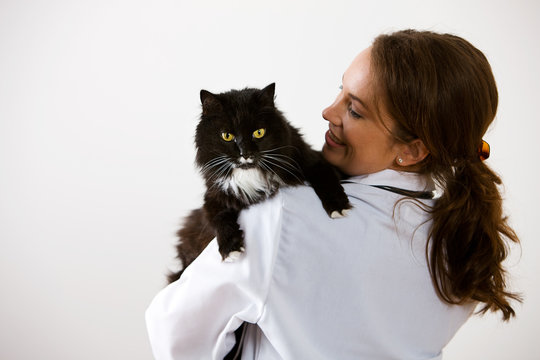 Veterinarian: Woman Holding Pet Cat