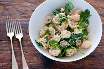 food plate of pasta, ricotta, pesto and basil