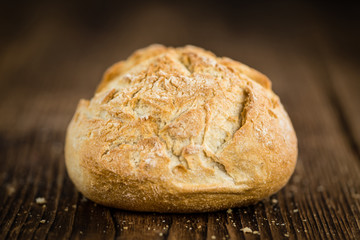 Wooden table with German Rolls, selective focus