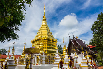 Fototapeta premium Thai Buddhist temple with blue sky in Thailand