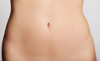 Fototapeta na wymiar Woman slim belly