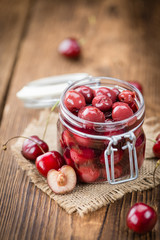 Fresh made Preserved Cherries on a rustic background