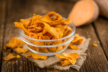 Fresh made Sweet Potato Chips on a rustic background