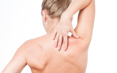 Woman has neck pain. Nude shoulders girl from the back.