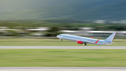 Airplane Take Off or Landing above Runway with Motion Blur Effect.