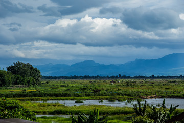 Fototapeta na wymiar Inde Lake, Myanmar, floating garden, cloudy day, clouds, mountain
