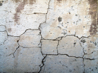 Old cracked wall of white color