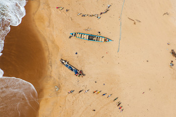 Pescadores en la playa de Lome. Togo - obrazy, fototapety, plakaty