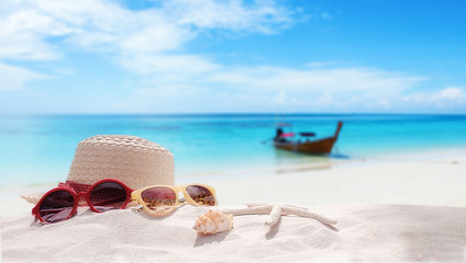 Fototapeta na wymiar Summer vacation concept with accessories on sandy beach