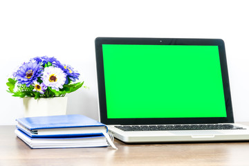 Laptop blank screen for text or pictures on wooden table. Concept for advertising, business and home office.