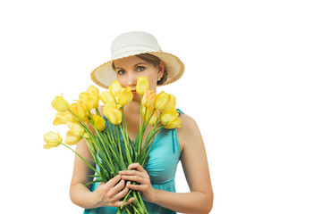 Woman in summer hat with a bouquet of tulips isolated on white background.