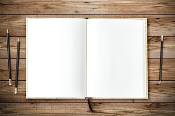 Top view of blank paper page on wood background office desk and different objects. Minimal flat lay style