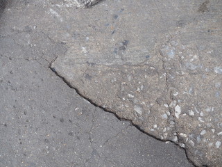 Uneven asphalt stone texture pattern grey paved road background