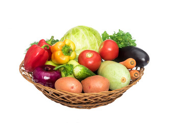 Basket with fresh mixed vegetables on white background