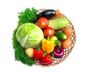 Basket with fresh mixed vegetables on white background