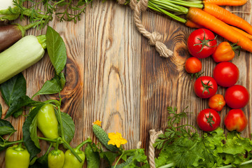 Fresh vegetables. Rustic wooden background.
