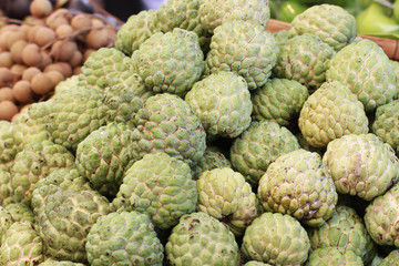 group of green fresh organic custard apple at asia fresh market, sweet taste fruit, backgrounds, tropical climate fruit, 
