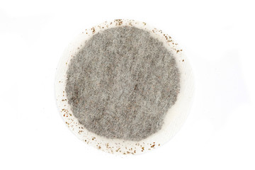 round tea bags on white