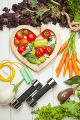 Fresh vegetables. Diet, a healthy lifestyle. Sport, dumbbells and a skipping rope on a white background - 167872310