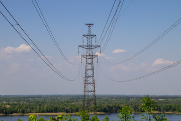 Obraz premium High voltage power line against blue sky