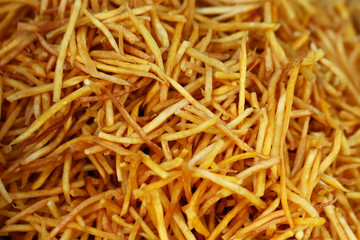 closeup group of French fries, potato, tiny slices, stick, chip, yellow crispy at asia fresh market , secret delicious recipe snack, backgrounds, wallpaper